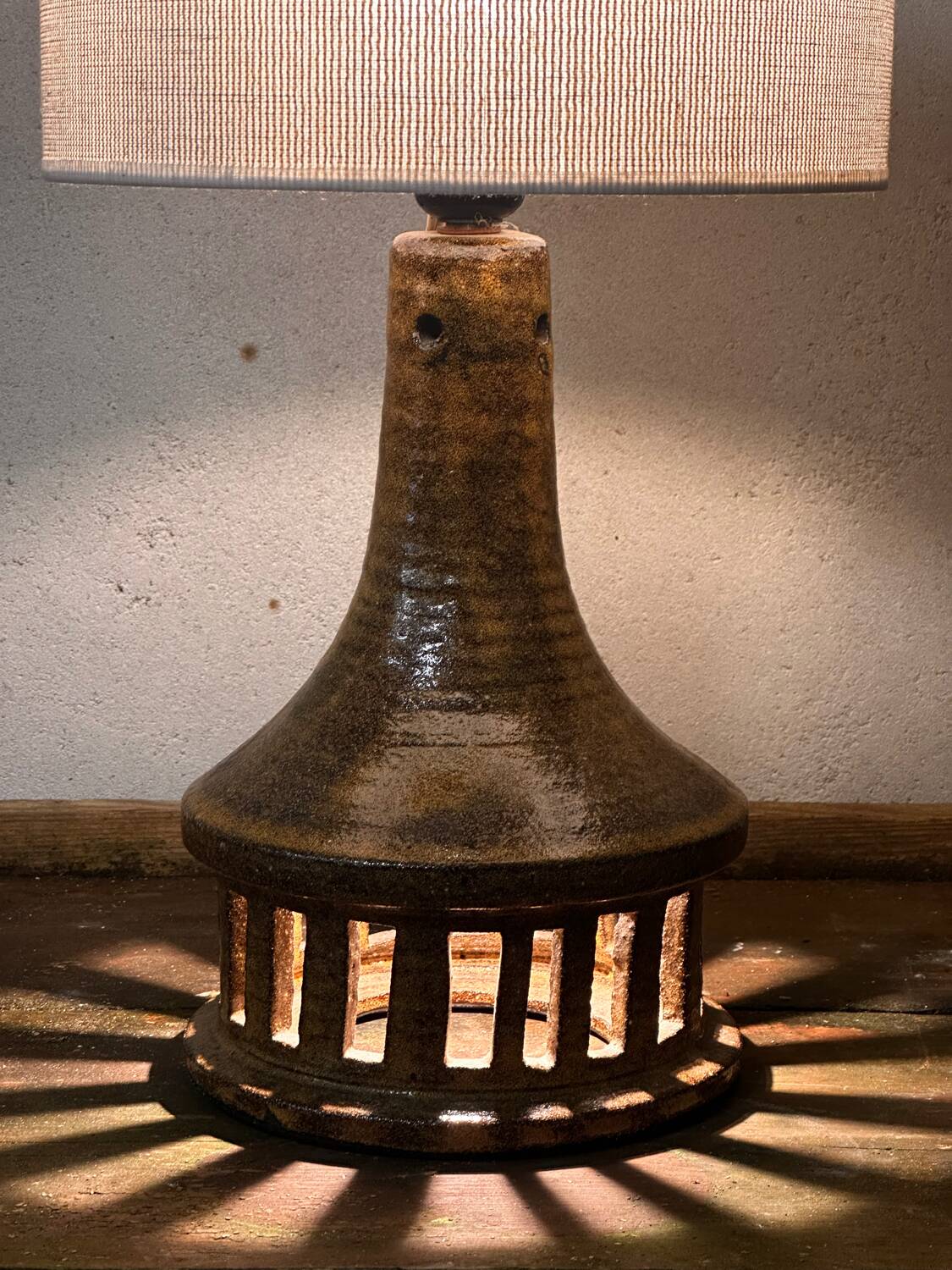 Vintage ceramic table lamp with integrated light base.