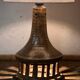 Vintage ceramic table lamp with integrated light base.