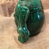 Porcelain pitcher in the shape of a barrel, with its handle that looks like a vine stock