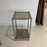Bolster or end table in chrome steel with smoked window.