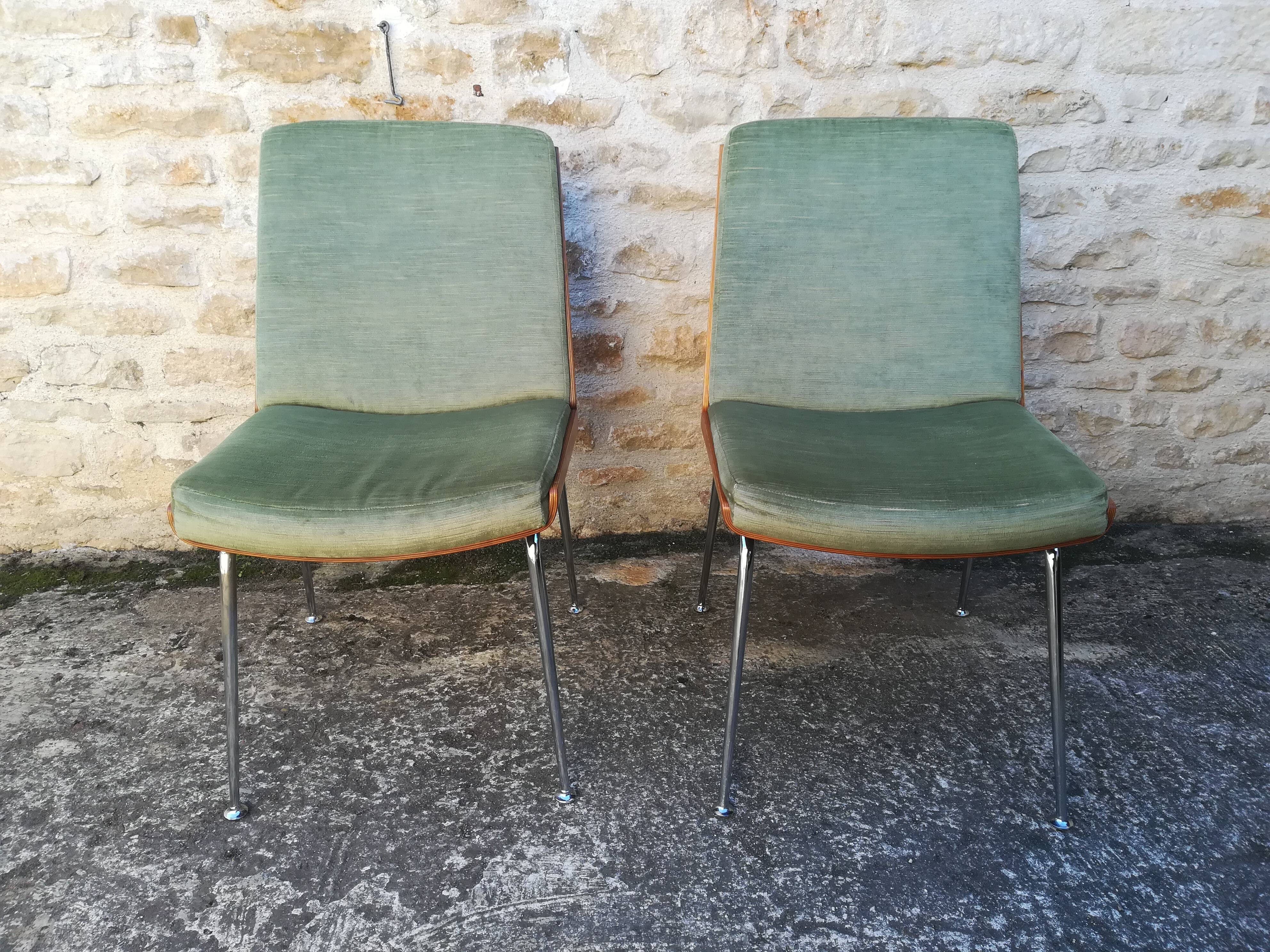 Shell chairs and green fabric