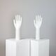 Pair of authentic vintage jewellery displays in industrial porcelain representing hands.
