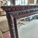 Large bevelled mirror with a carved wooden frame