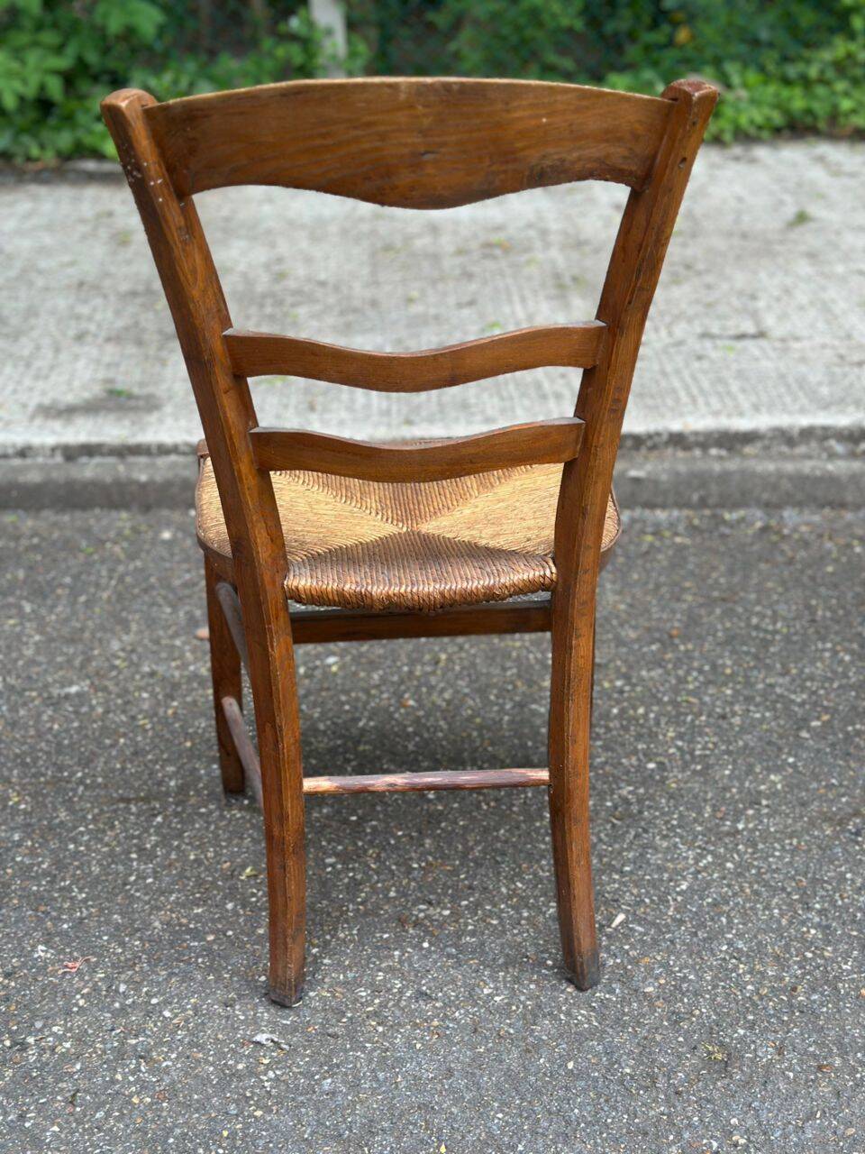 Period rustic chair with a straw seat