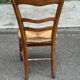 Period rustic chair with a straw seat