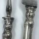 Antique silver-plated metal serving cutlery.