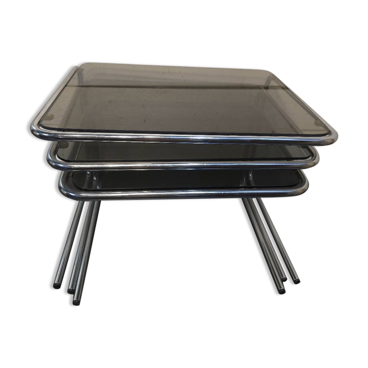 Nesting tables in chromed metal with smoked glass tops from the 1970s