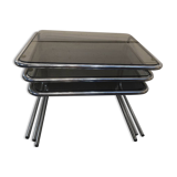 Nesting tables in chromed metal with smoked glass tops from the 1970s