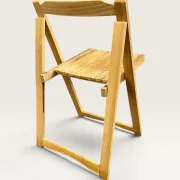 Blonde wooden folding chair in the style of Aldo Jacober.