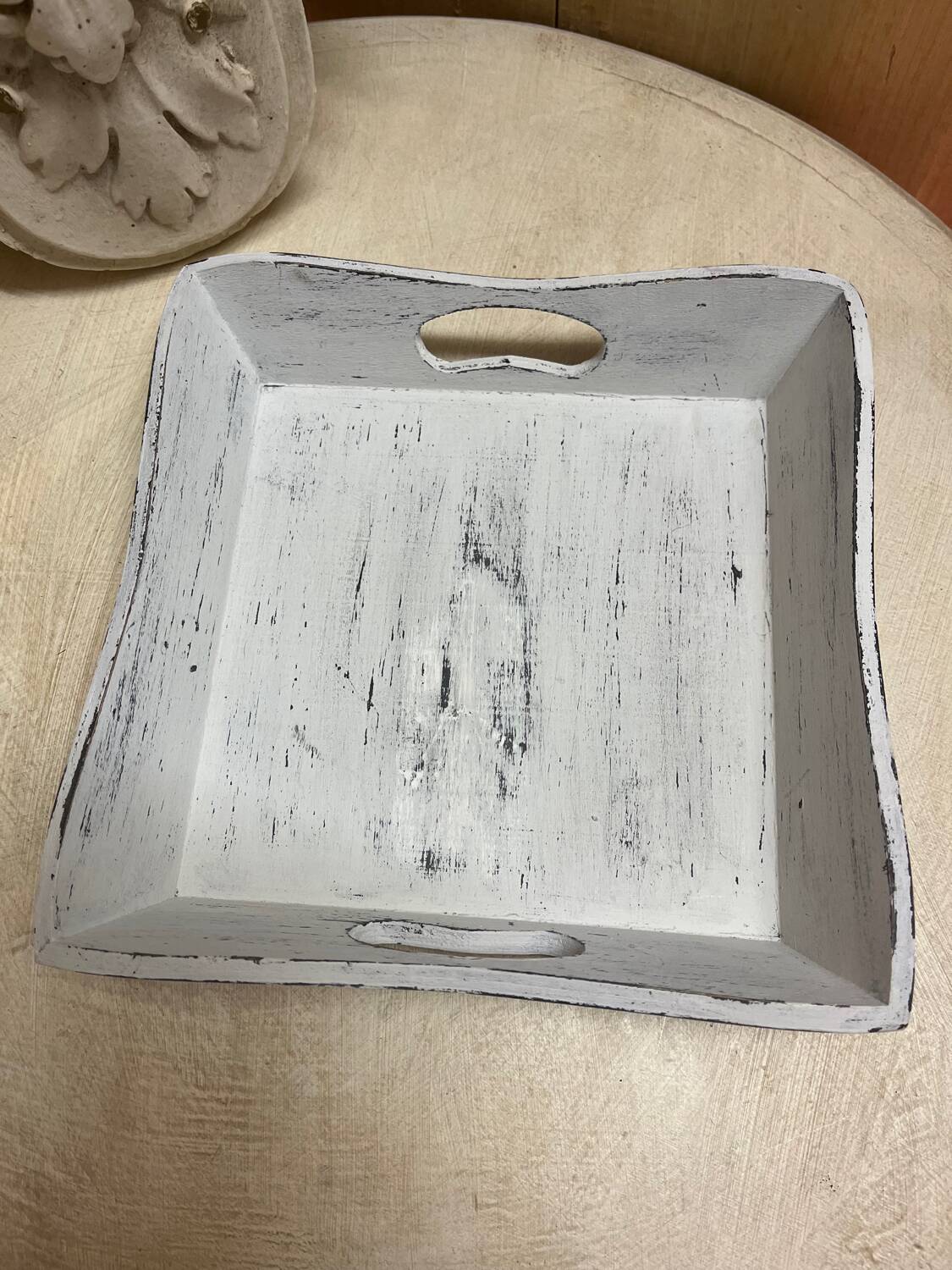 Old wooden tray with aged white patina
