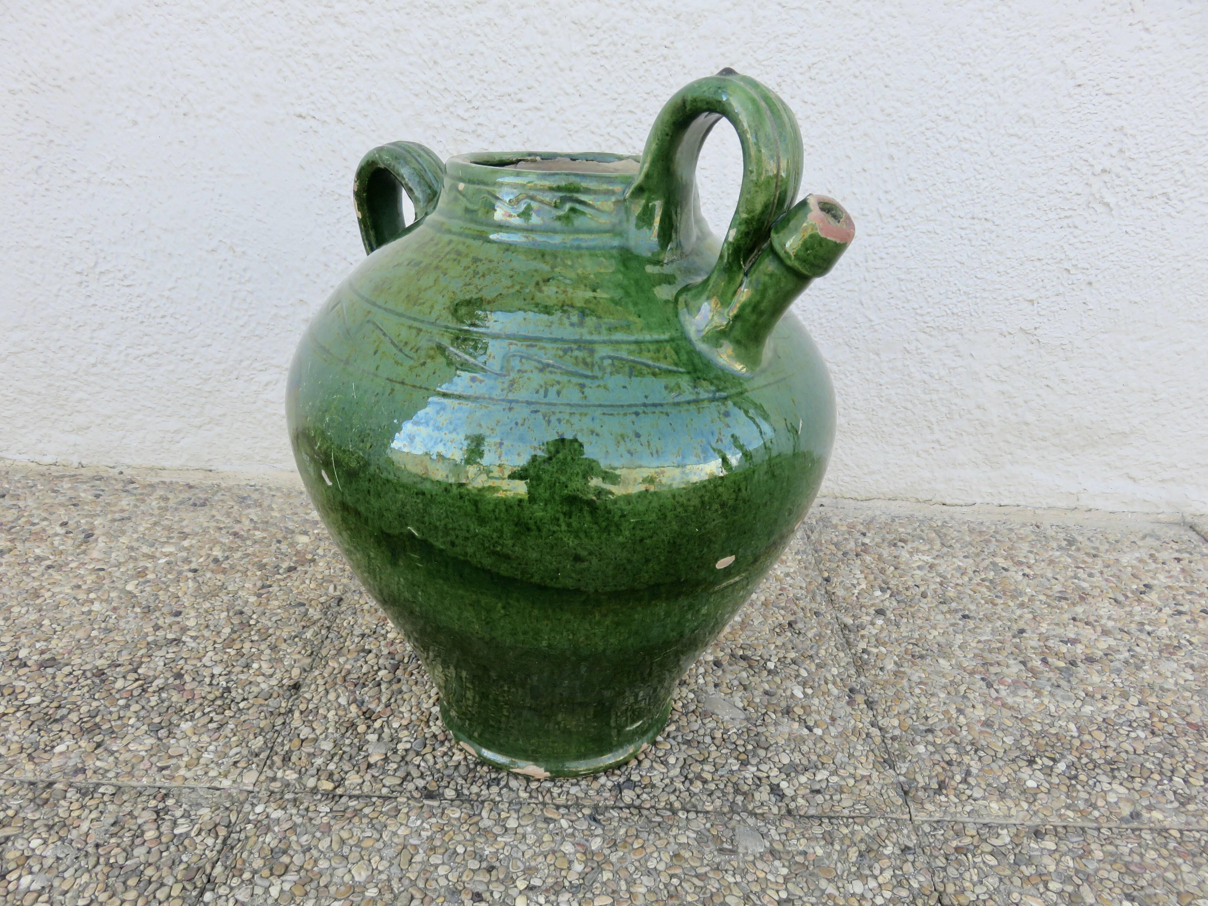 Antique glazed green terracotta oil jar, late 19th century.