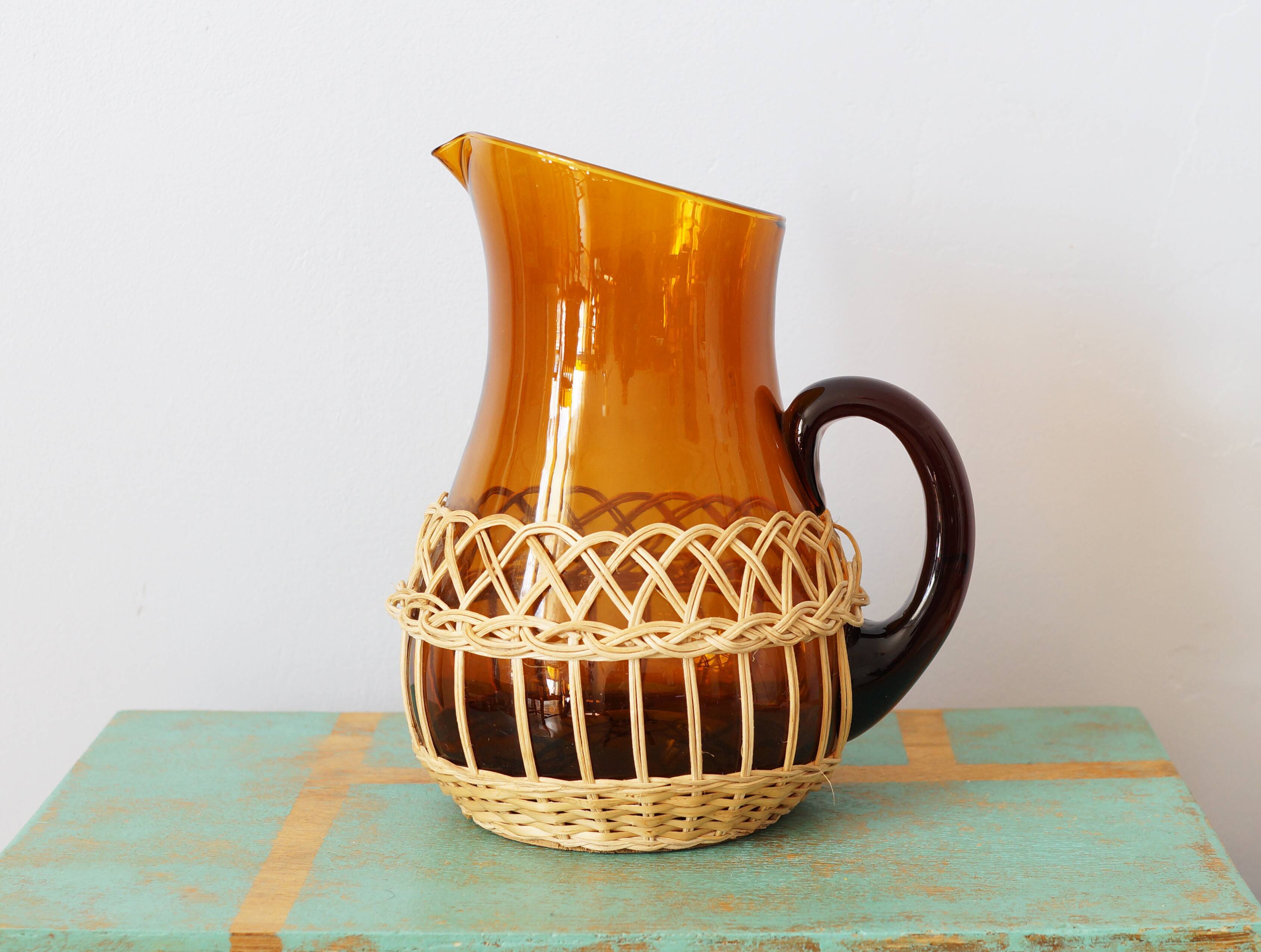 Amber glass decanter dressed in wicker, vintage
