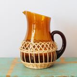 Amber glass decanter dressed in wicker, vintage