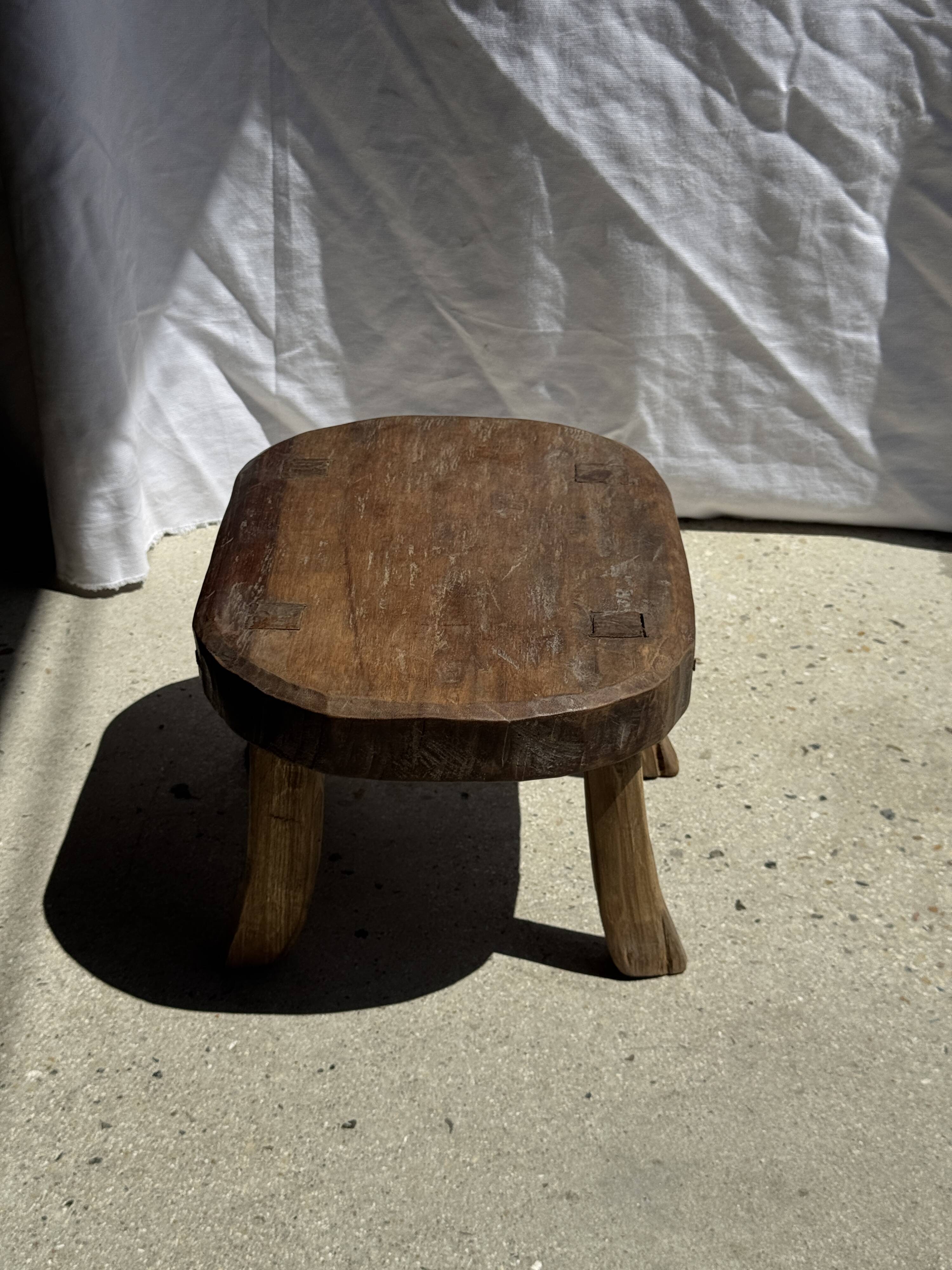 Small stool, oval solid teak accent stool with a two-tone seat.