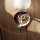 Frosted glass globe wall light with patinated gold metal base dp 1123204