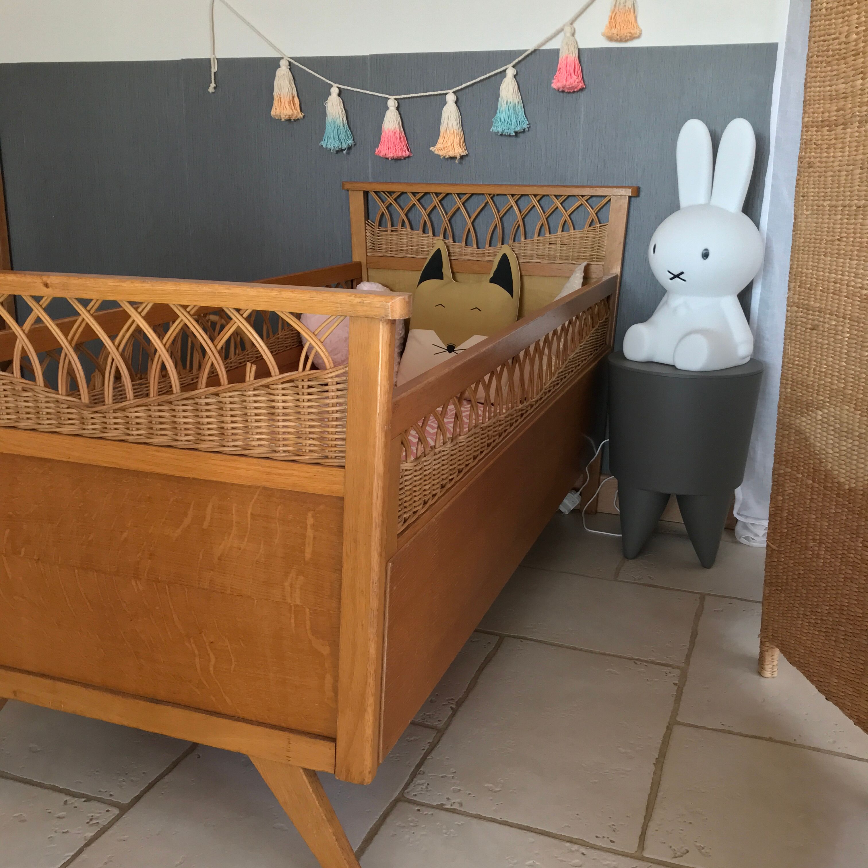 Rattan baby bed and vintage wood