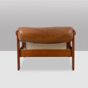 Lounge chair and ottoman, in blond elm and leather. 1970s