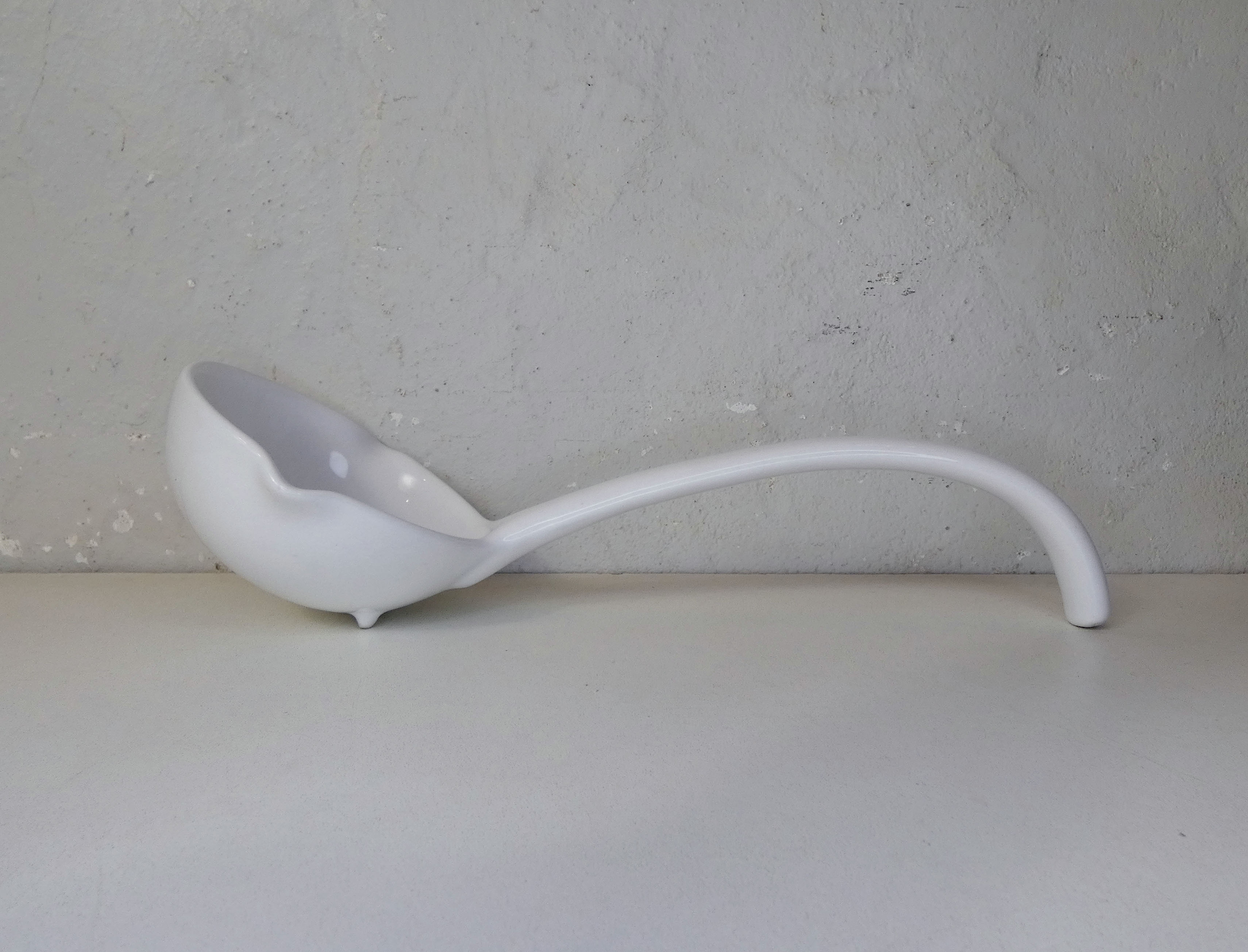 White ceramic ladle