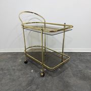 Desserte en laiton et verre fumé des années 1960