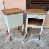 Renovated bedside tables in laurel green and light wood.