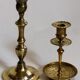 Duo of solid brass and gold metal candle holders worked old