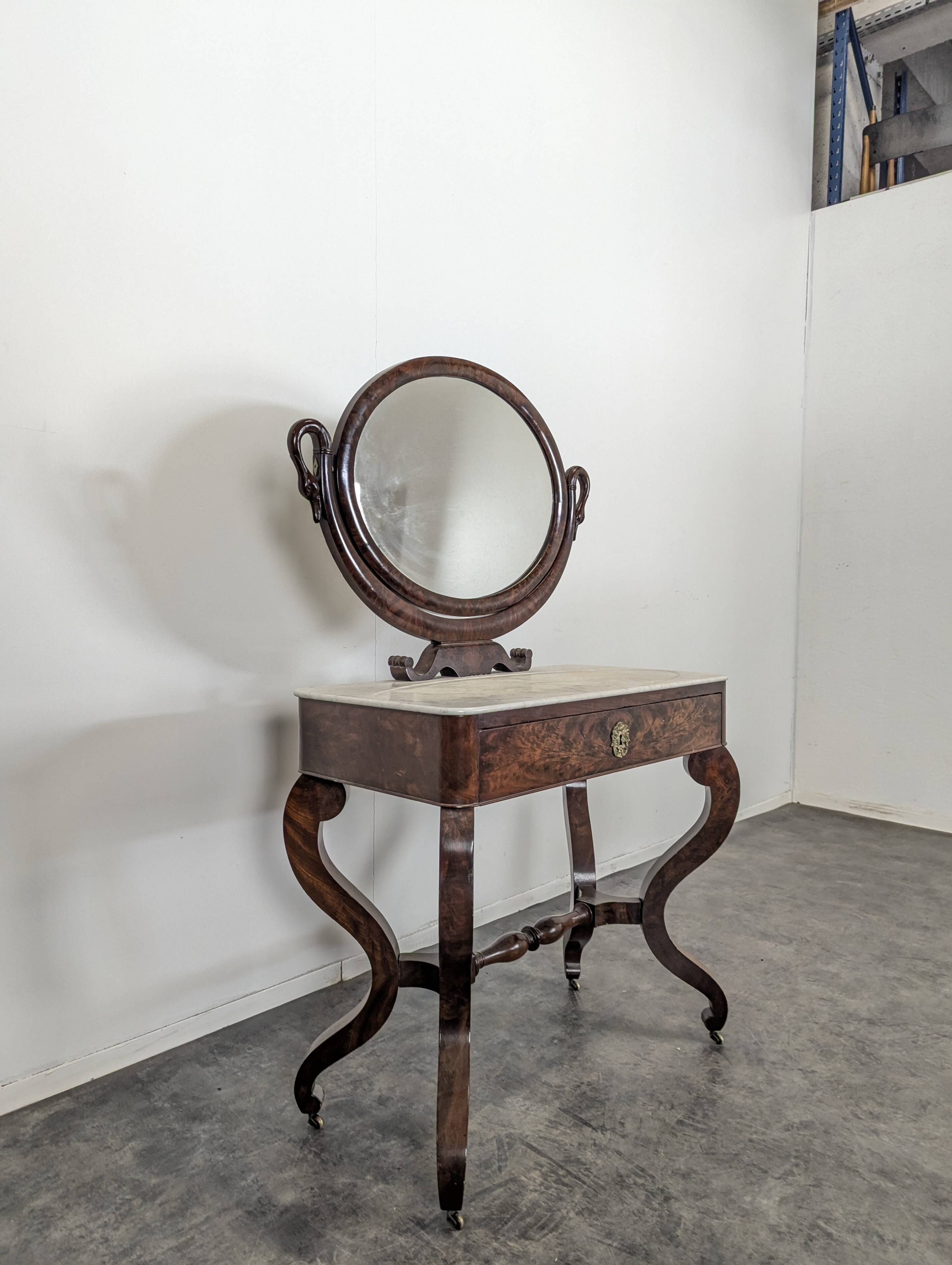 Restoration period flamed mahogany swan neck dressing table