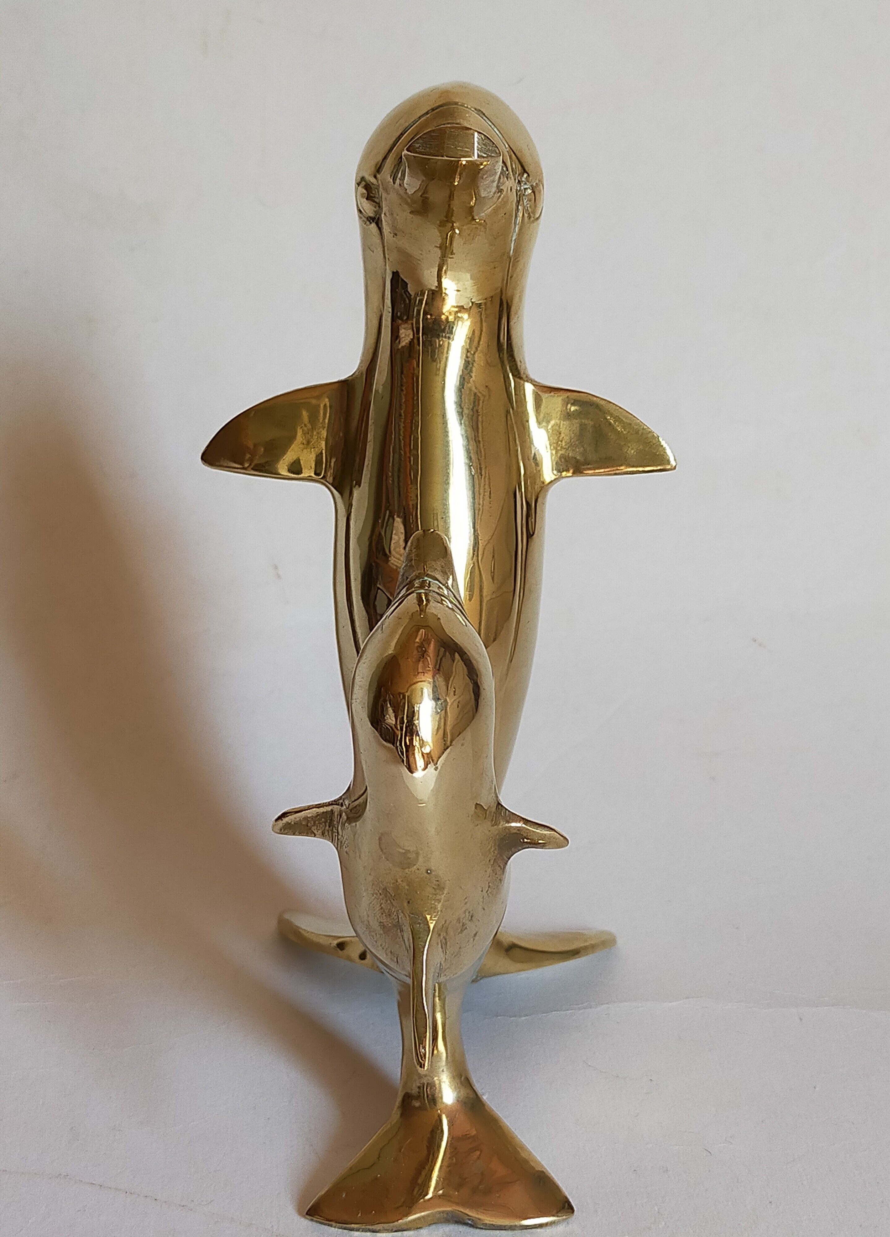 Vintage solid brass dolphins