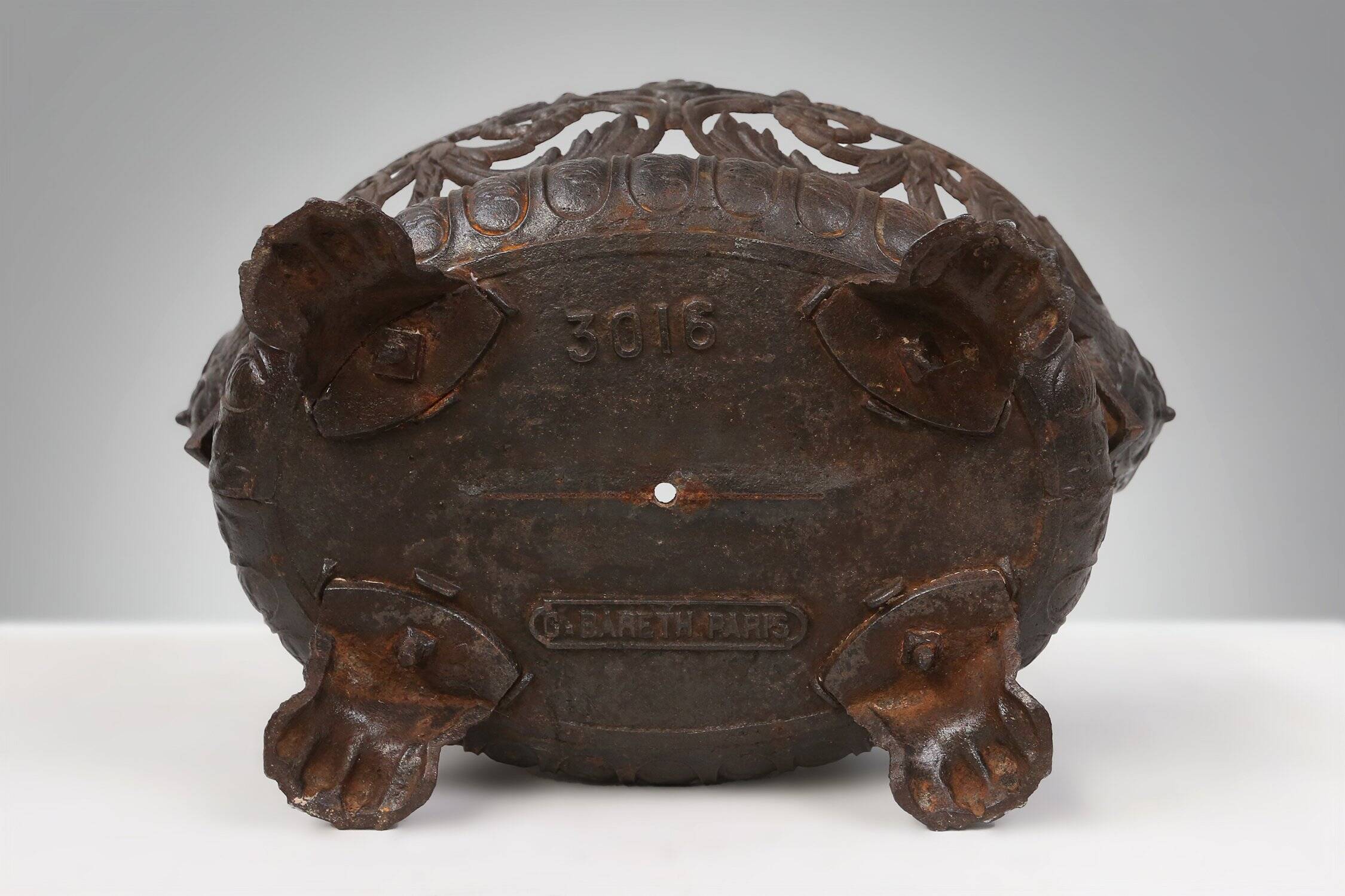 Cast Iron planter decorated with masks and lion paws, France 1850s