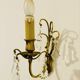 Brass wall light with glass pendants from the mid-20th century.