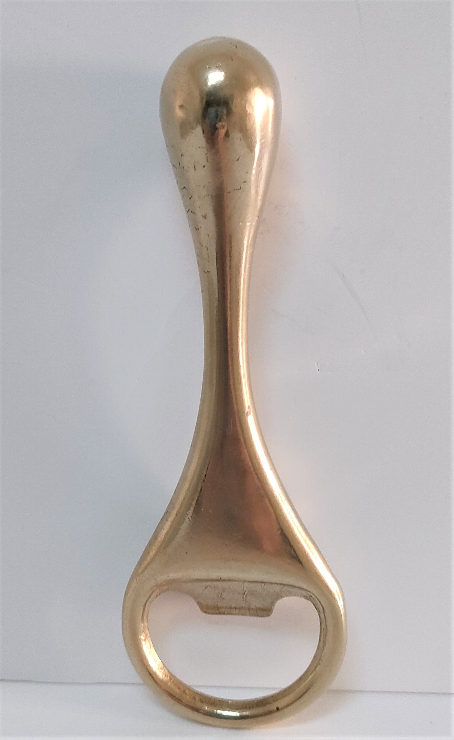 Modernist solid brass bottle opener by Carl Auböck