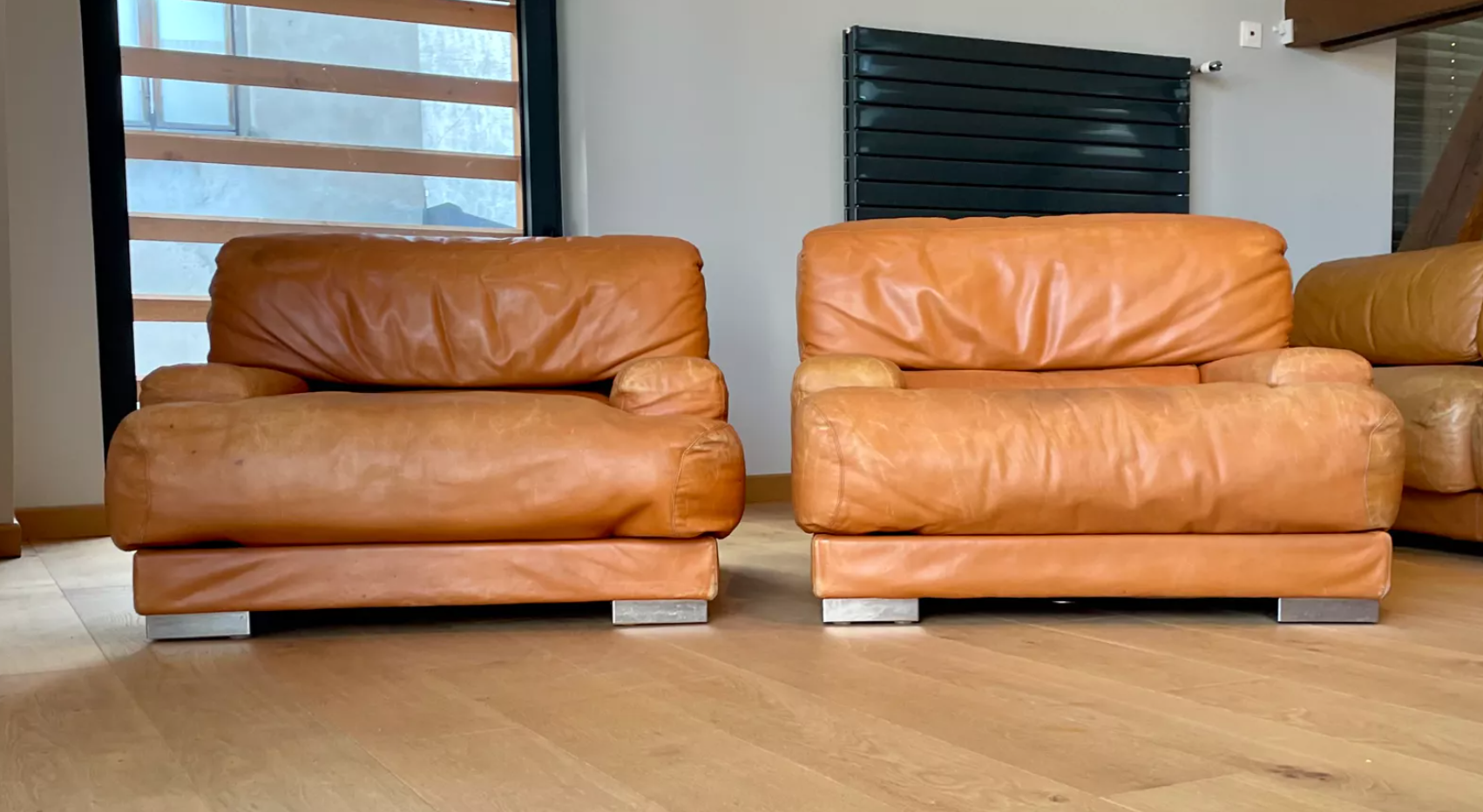 Pair of vintage armchairs Gérard Guermonprez tawny leather and stainless steel, France 1970