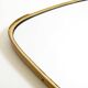 Heavy mid-century brass kidney-shaped wall mirror from Münchner Zierspiegel