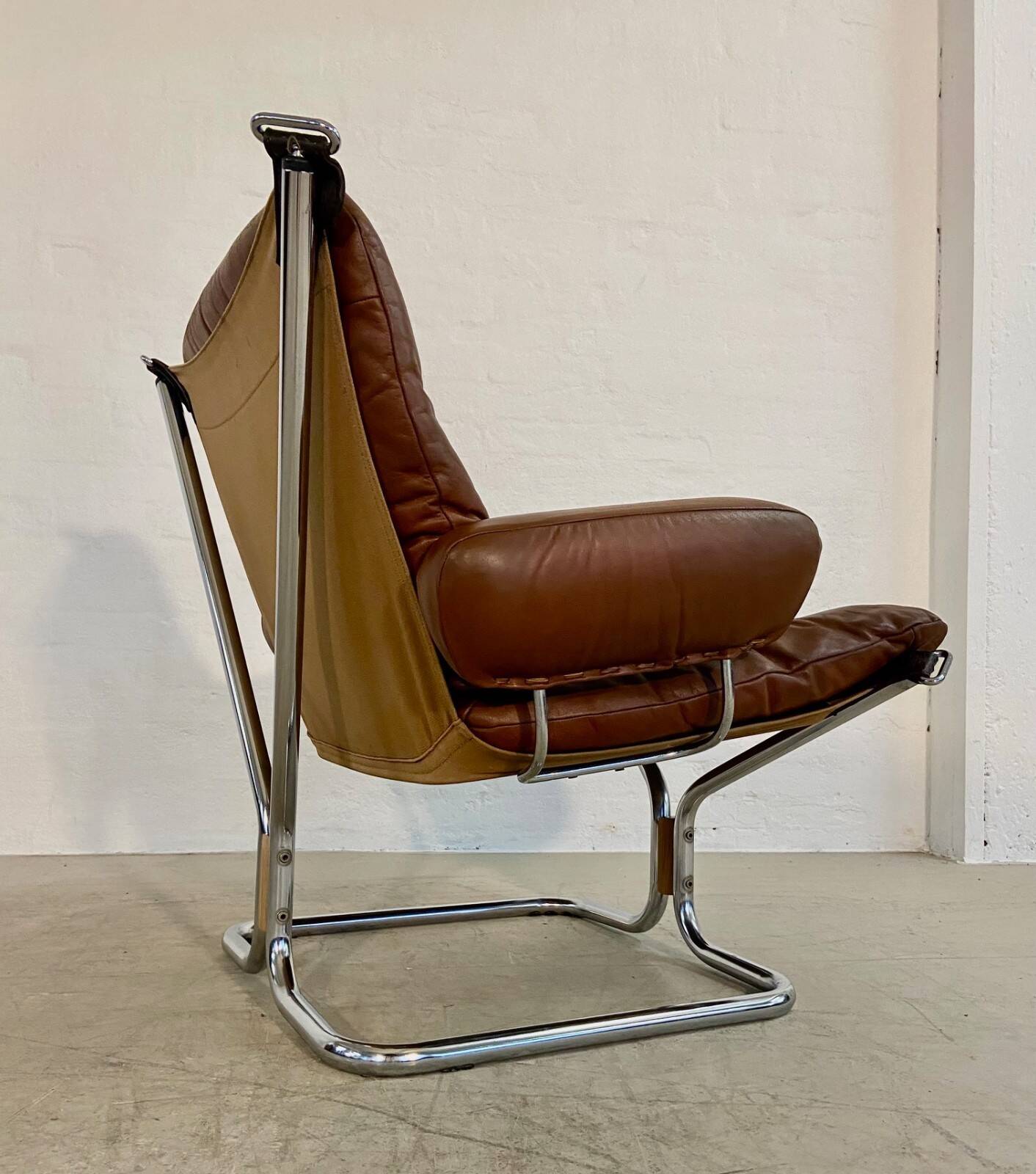 Vintage mid-century Scandinavian cognac leather lounge chair by Harald Relling