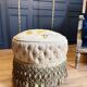 Pouf d'époque Napoléon III en tissu capitonné d'origine à roulettes