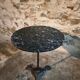 Old French bistro table with a marble top and a cast iron base.