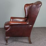 Leather armchair with decorative nails