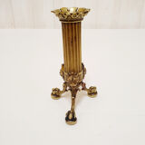 Golden candle holder with lion's head and legs