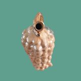 Pitcher of alpho grape cluster