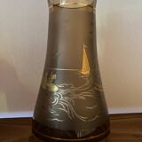 Vintage smoked glass carafe with gold from the 50s/60s, featuring a marine and water skiing design.