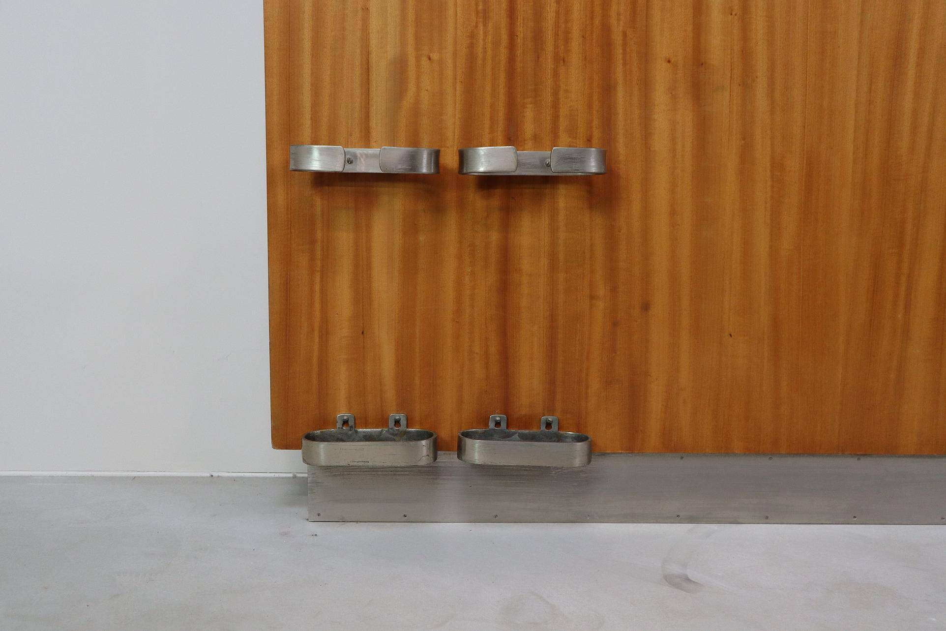 Modernist wall-mounted cloakroom in teak