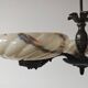 Art Deco bronze three-arm chandelier with marbled glass shades.