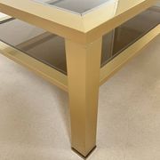 Table basse grand modèle en métal doré, France années 70