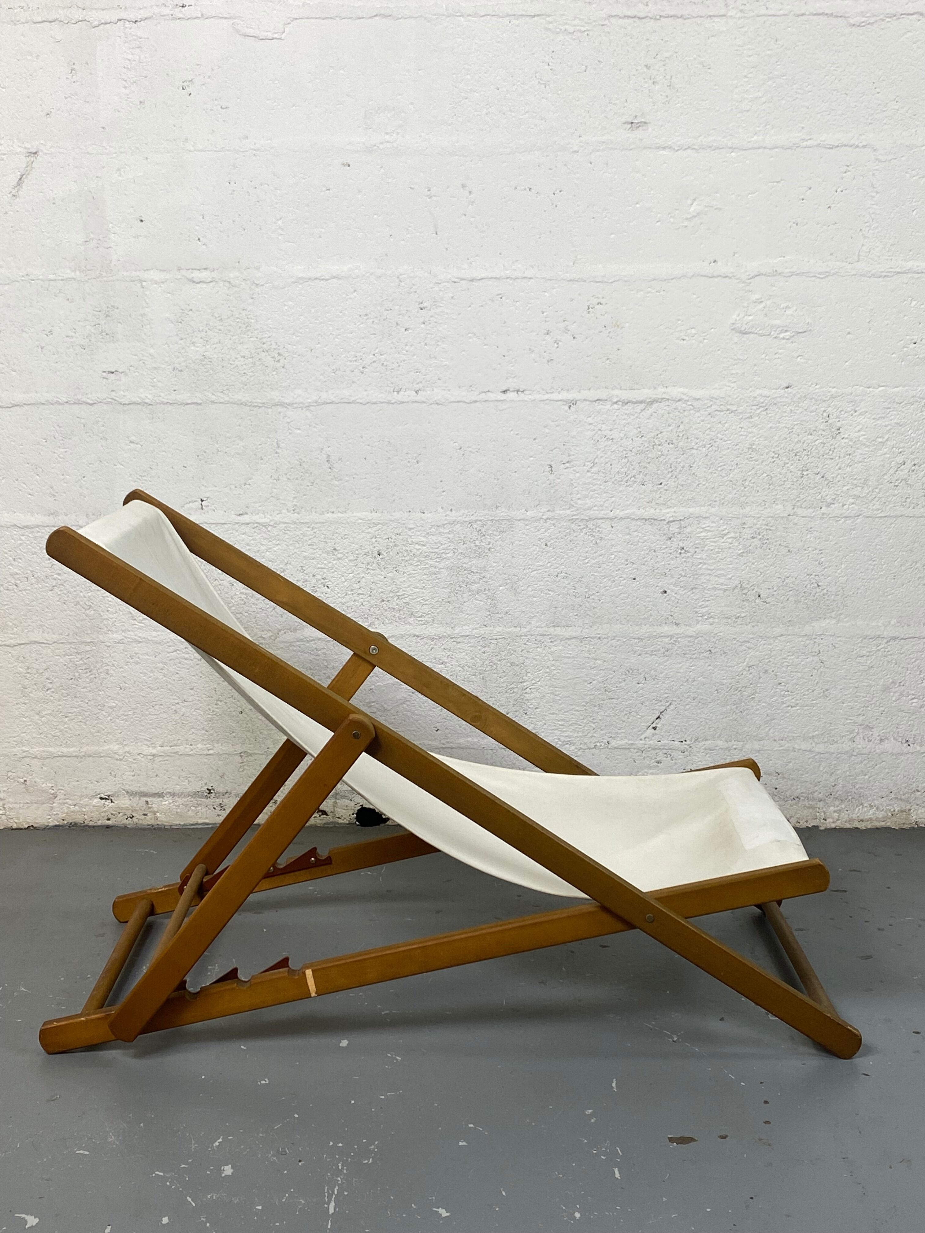 White fabric deckchair with wooden structure