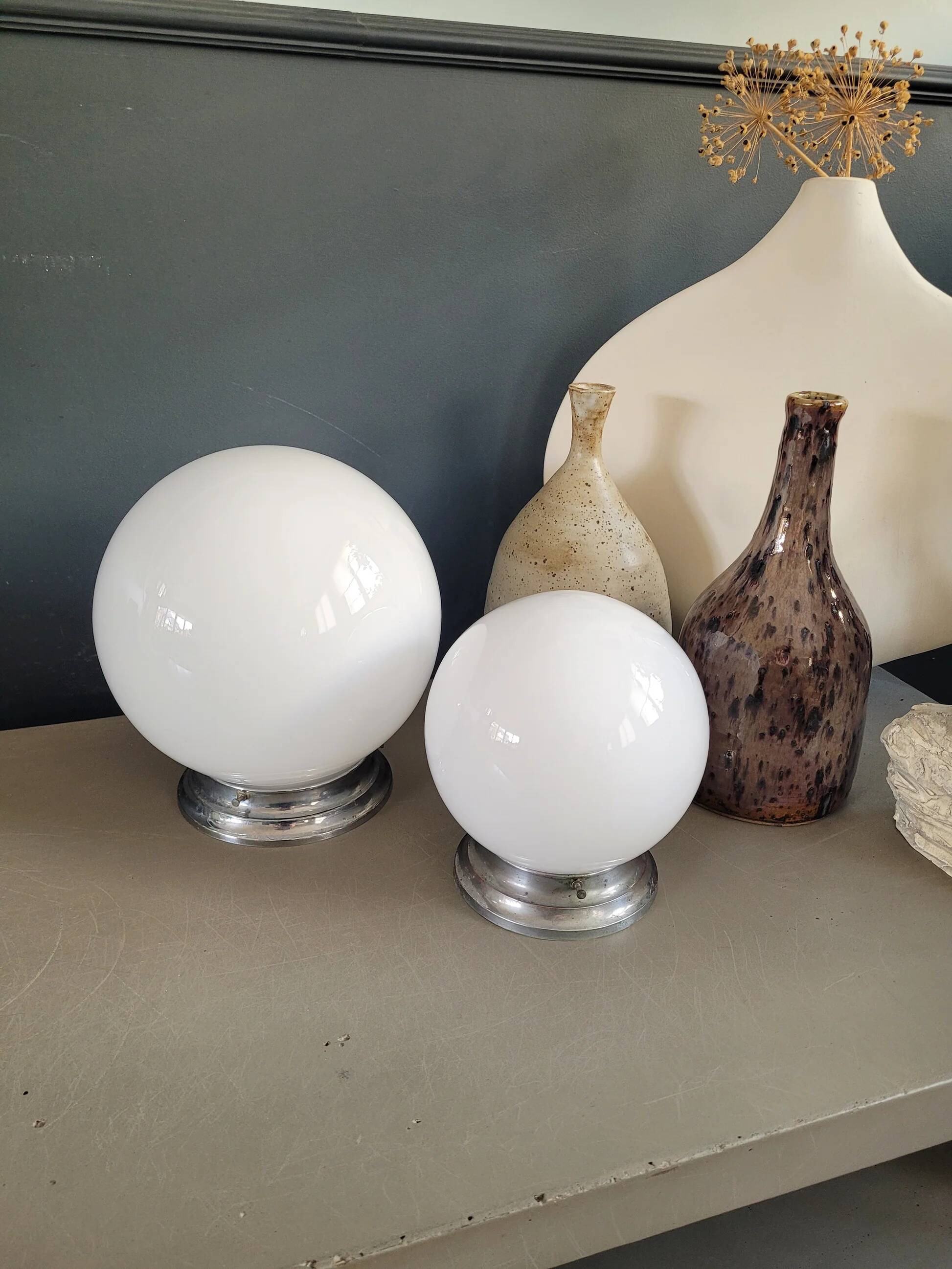 Pair of ceiling lights or wall lights with white glass globes.