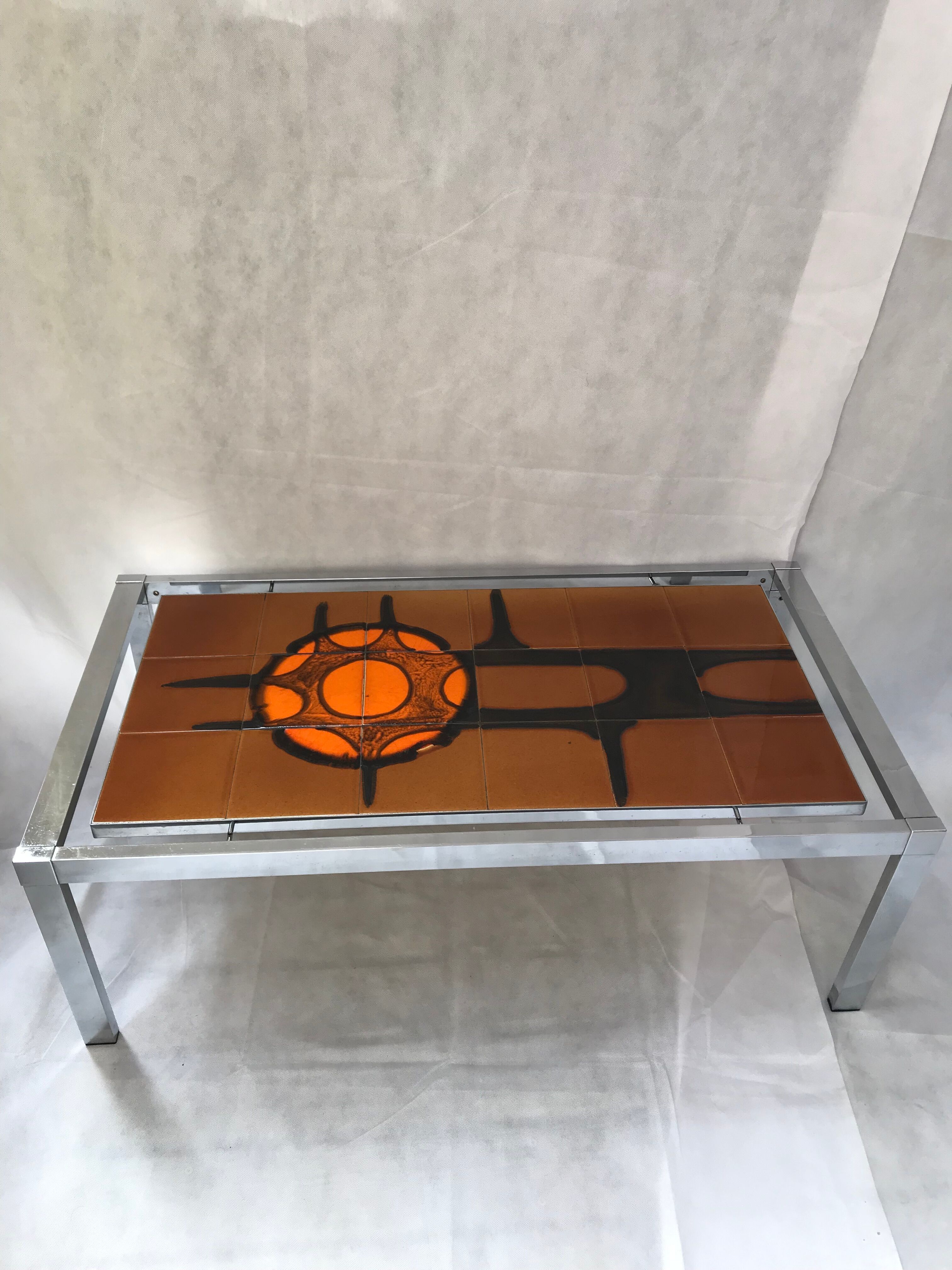 Metal and ceramic earthenware coffee table