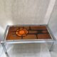 Metal and ceramic earthenware coffee table