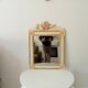 Vintage bohemian mirror from the 80s in carved wood.