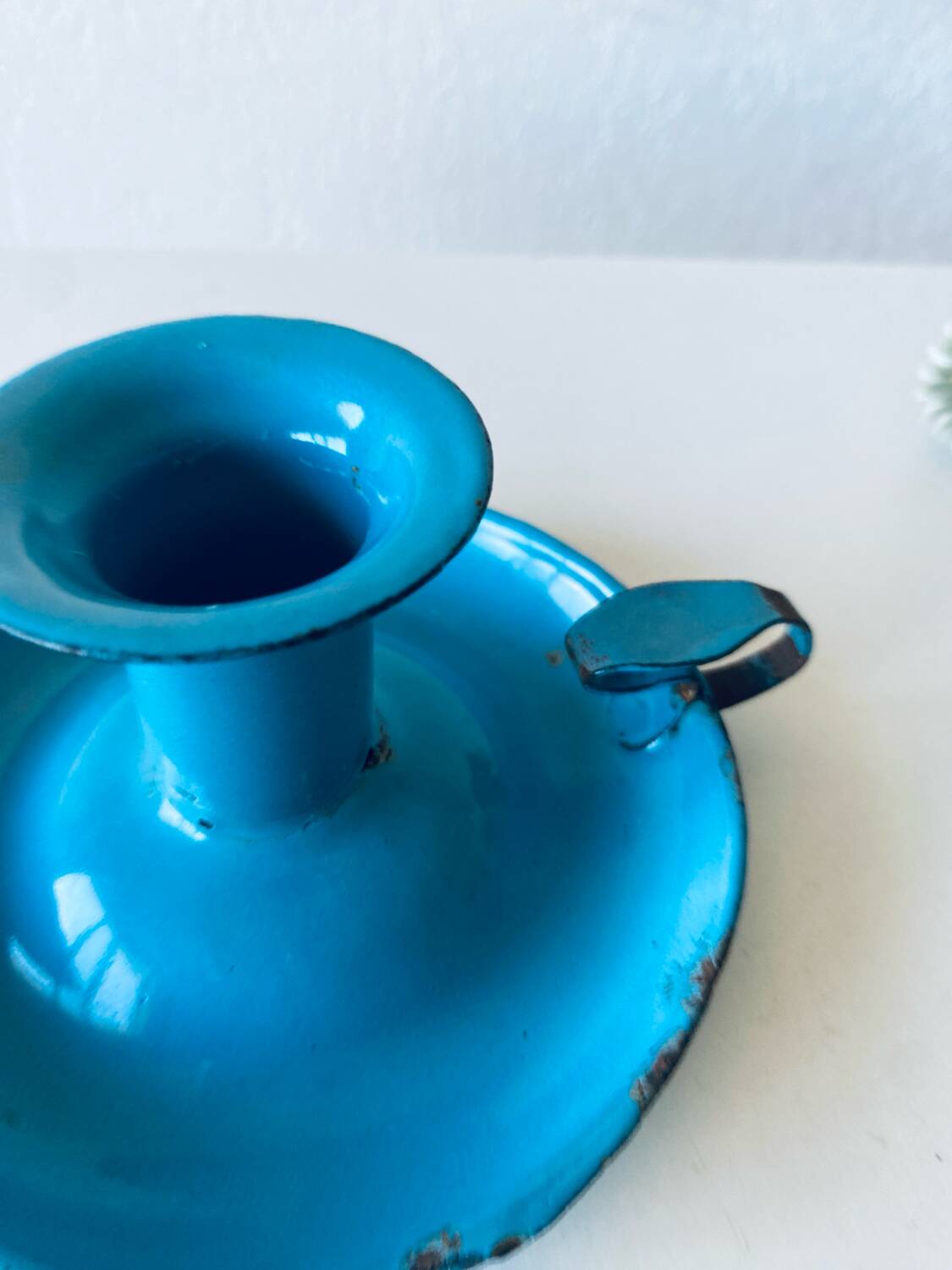 Antique enamelled metal candle holder