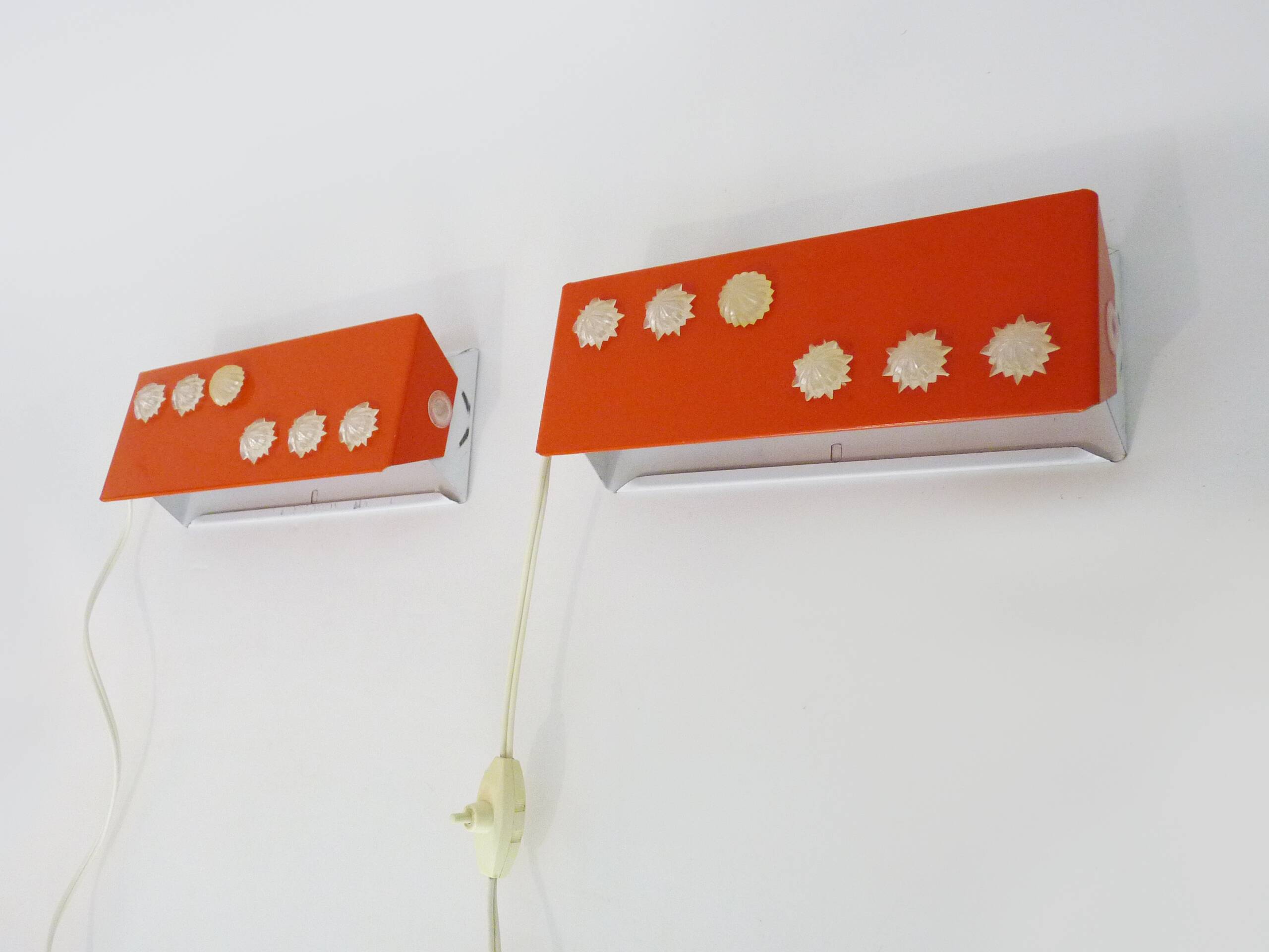 Pair of Scandinavian wall sconces with swivel shade in orange metal. 70