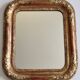 Miroir Louis-Philippe en bois et stuc doré à décor floral, XIXe,  43x38 cm